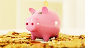 Piggy Bank surrounded by gold coins - Recognizing Your Worth